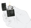 Playboy Logo Black Matte Windproof Lighter lit in hand