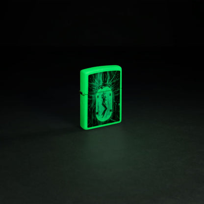 Glamour shot of Zippo Tube Woman Design Glow in the Dark Matte Windproof Lighter glowing in the dark.