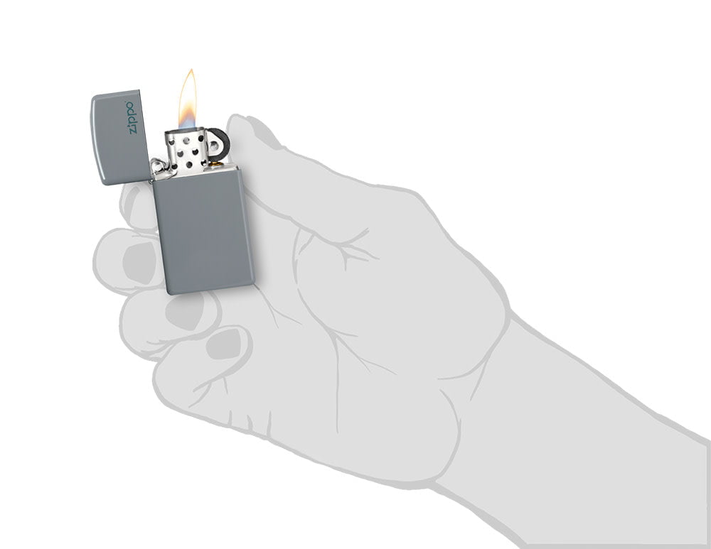 Zippo Slim Flat Grey Zippo Logo Pocket Lighter lit in hand.