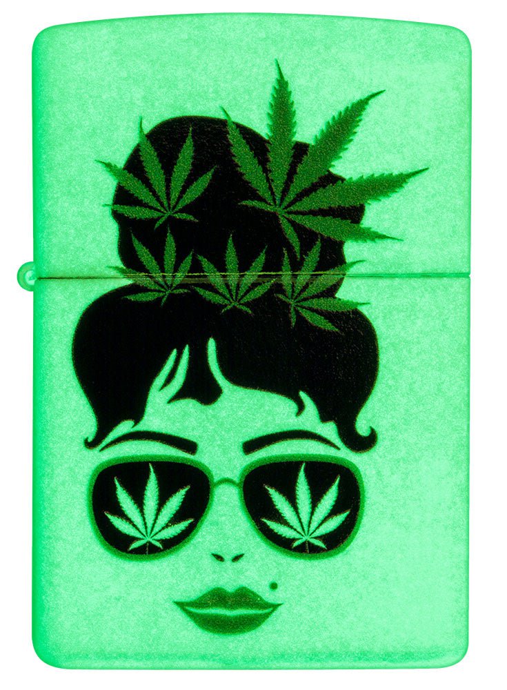 Front shot of Zippo Cannabis Girl Design Glow In The Dark Pocket Lighter glowing in the dark.