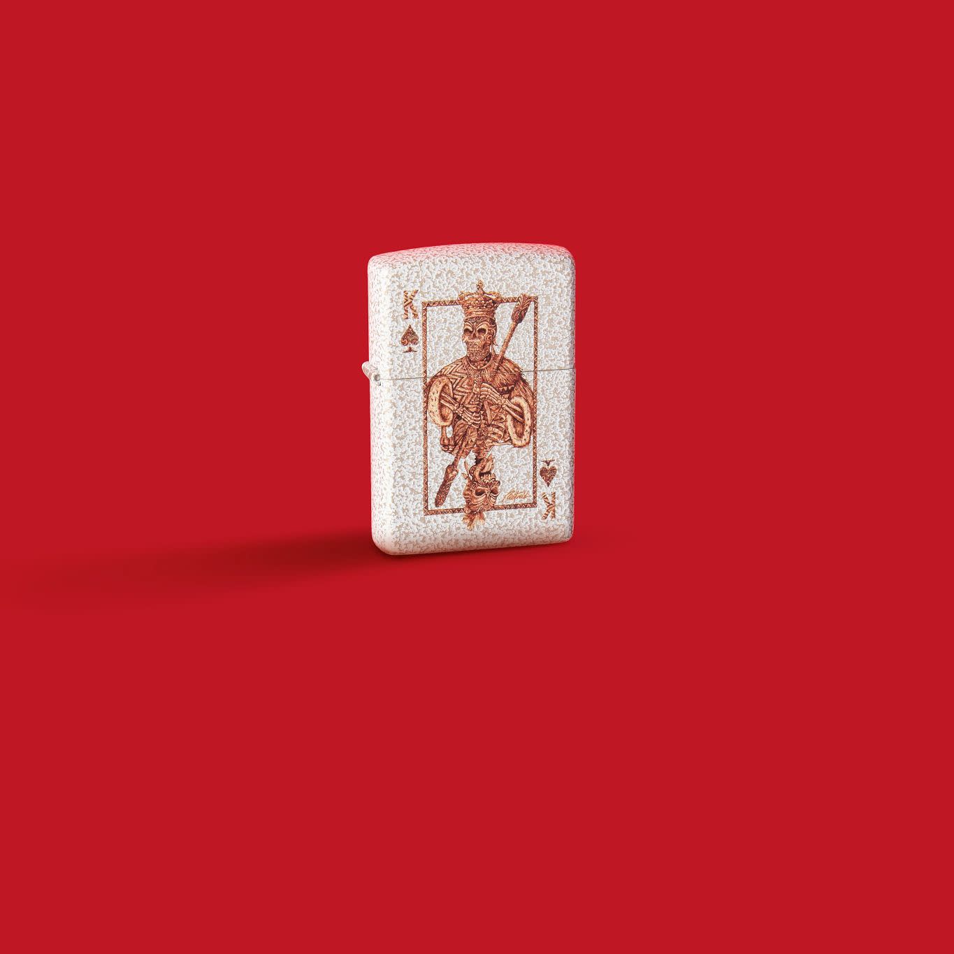 Glamour shot of Zippo Rick Rietveld Ace Skull Design Mercury Glass Windproof Lighter standing in a red scene.