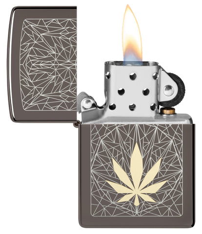 Cannabis Design Laser Two Tone Black Ice Windproof Lighter with its lid open and lit.